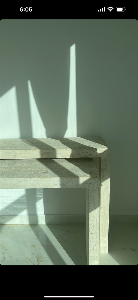 Curved two luxurious consoles made of light travertine